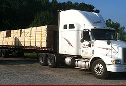 K. R. Snead tractor hauling lumber